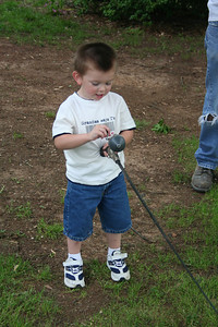  > PaPaw gave Gage a fishing rod to practice with!
